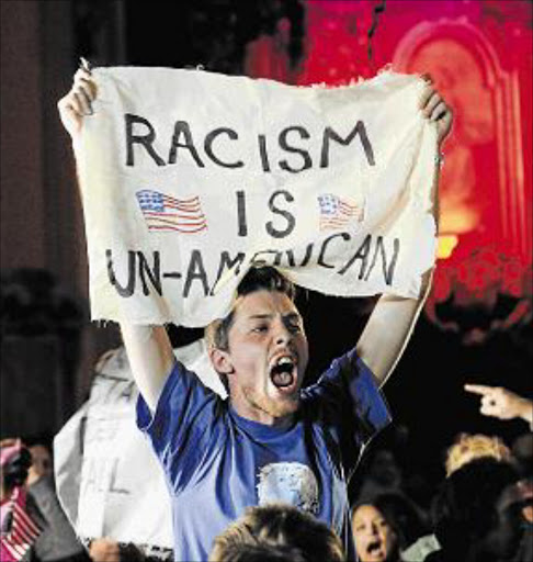 FURY: A protester interrupts Donald Trump’s speech at a campaign rally in Kansas Pictures: REUTERS