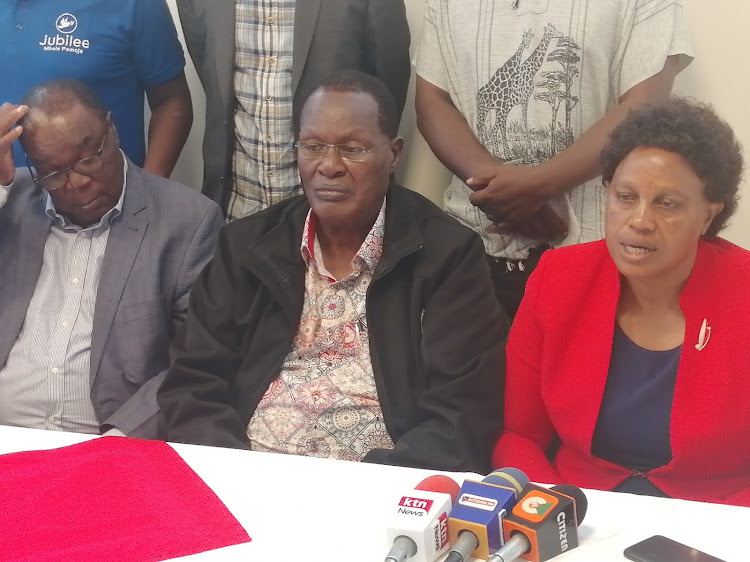 Jubilee deputy party leader Jimy Angwenyi, Kisii governor aspirant Chris Obure and woman rep aspirant Peris Onsarigo during a press conference in Kisii town