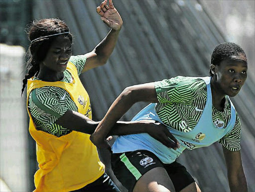 GUARDED: Melinda Kgadiete of South Africa evades a challenge from fellow South African Regina Mogolola during a Banyana Banyana training session at Athlone Stadium in Cape Town Picture: BACKPAGEPIX