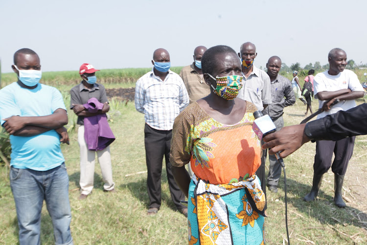 Molly Adhiambo, a farmer from Ombeyi in Muhoroni subcounty, addresses the media