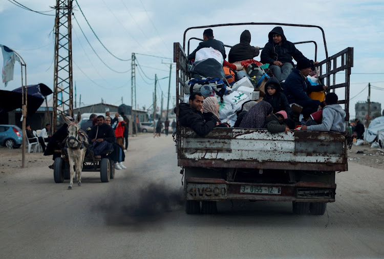 Palestinians leaving Rafah, in fear of an Israeli military operation, amid the ongoing conflict between Israel and Palestinian Islamist group Hamas in the southern Gaza Strip on February 13 2024.
