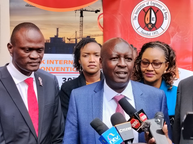 Institution of Engineers of Kenya president Erick Ohaga and Principal Secretary in the ministry of roads Joseph Mbugua addressing the media on the sidelines of the launch of this year’s 30th IEK international convention.