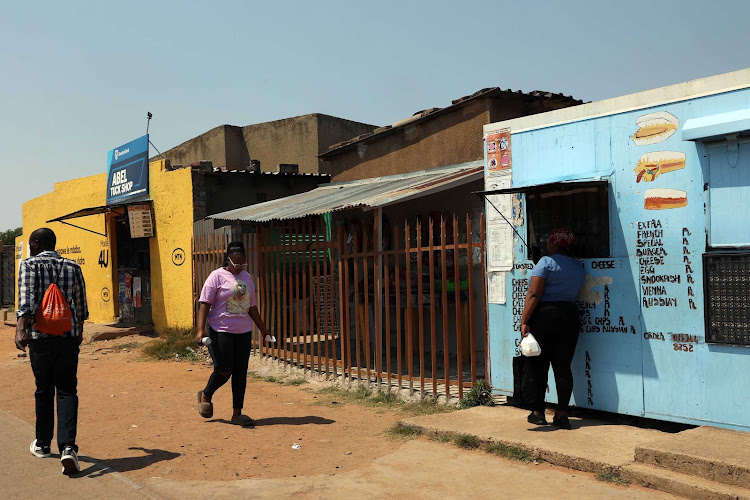 Residents go about their business in Orlando East, Soweto, yesterday. Consumers have been urged to check sell by dates on products on offer in spaza shops.