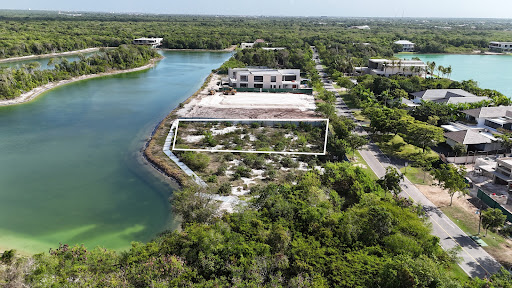 Vacant lot bordered by water and vegetation in this luxury land for sale in Punta Cana ($775,000 - 1,759 m²)