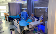 Aisha Milad Belhassna, a nurse wearing a protective suit, cares for patient infected with the coronavirus disease (COVID-19) at a quarantine centre, in Misrata, Libya on September 7, 2020. P