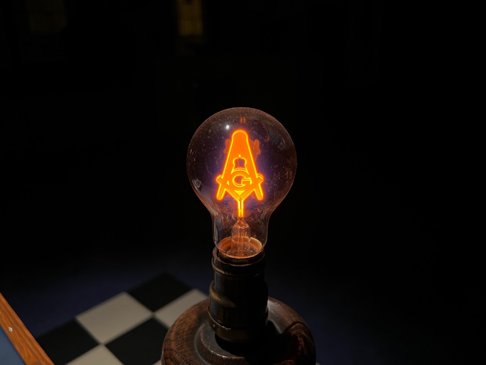 Image of light with Masonic square and compass