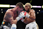 Azinga Fuzile (R) and Martin J. Ward battle during their IBF super featherweight title fight at Michelob ULTRA Arena on May 29, 2021 in Las Vegas, Nevada. 