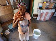 Ann Mouries, 57, of Hillside fills her bottles with water because she fears Beaufort West will soon run out of water. Pictured here 8 November 2017.