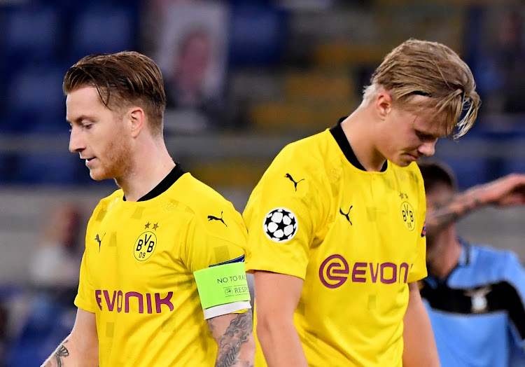 Borussia Dortmund's Marco Reus and Erling Haaland look dejected