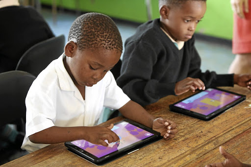 Mathonsi Msizi and Thandiswe Shabane, Grade 1 pupils from St Christophers Primary in Kwadukuza, KwaZulu-Natal, use tablets for better learning outcome.