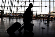 International travellers arrive at John F. Kennedy international airport in New York, US, on February 4 2017. The United States is screening visitors from Wuhan, China, at JFK and at airports in Los Angeles and San Francisco for people who may have symptoms of a new virus. 