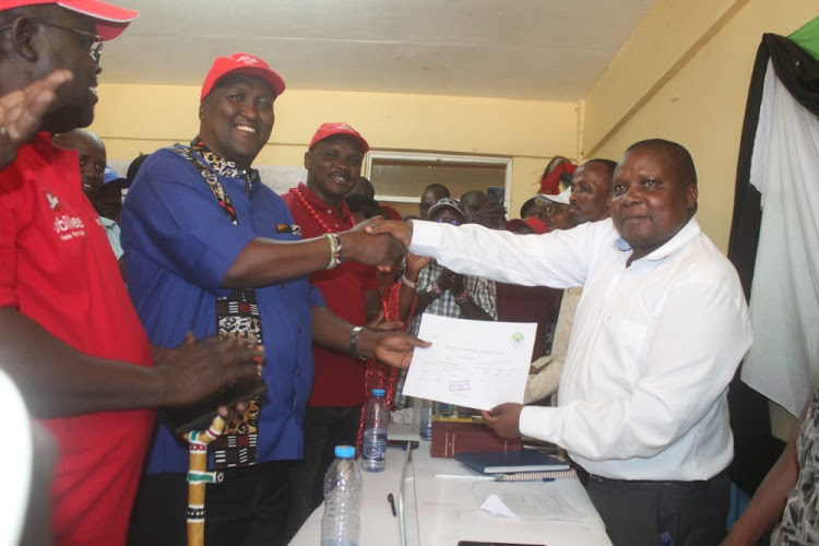 Former Petroleum and Mining CS John Munyes receives his clearance certticate from IEBC to run for the top seat in Turkana, June 6, 2022.