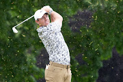 Rory McIlroy plays his shot from the fifth tee during the first round of the US Open golf tournament.