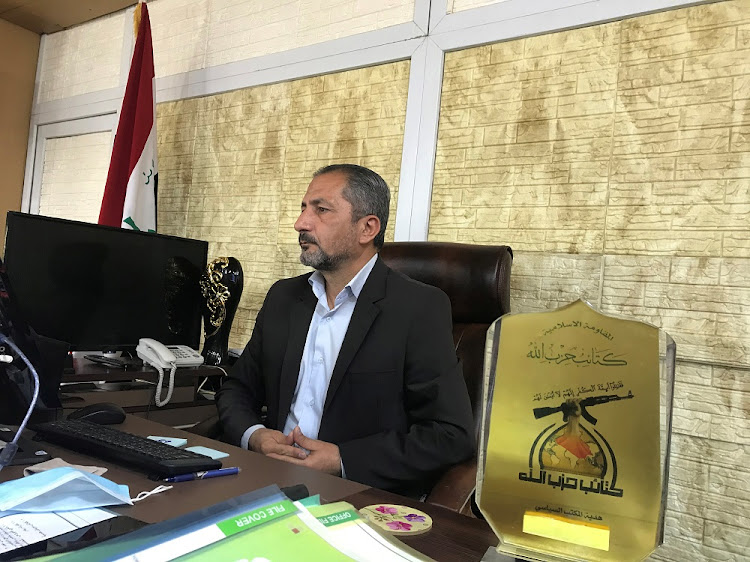 Mohammed Mohi, spokesman for Kataib Hezbollah paramilitary group attends an interview with Reuters in Baghdad, Iraq October 11, 2020.