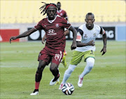 BATTLE IS ON:  Lerato Chabangu of Moroka Swallows is challenged by Vuyo Mere of Platinum Stars, who won 1-0 
    
      
      Photo: Lee Warren/Gallo Images