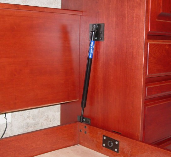 This murphy bed works using a piston lift mechanism