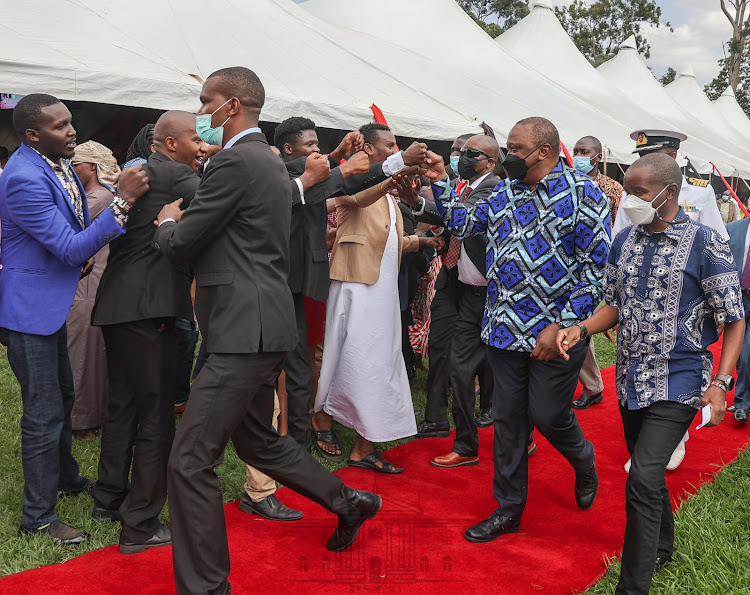 President Uhuru Kenyatta, and ICT CS Joe Mucheru at State House, Nairobi on Friday.