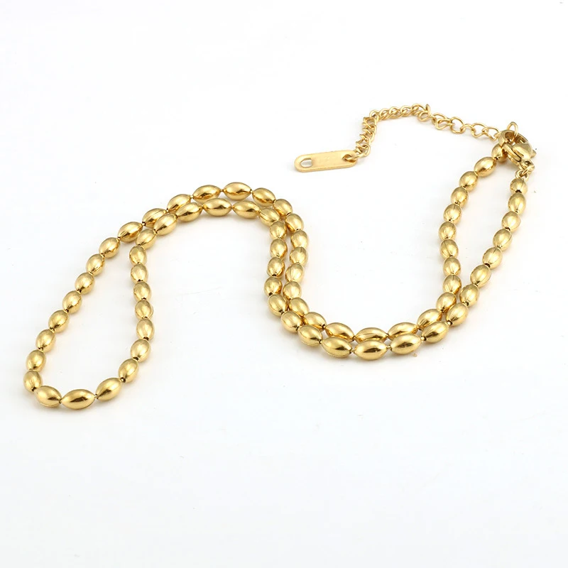 Collier chaîne à perles ovales en acier inoxydable plaqué or 18K, un bijou élégant et durable pour toutes les occasions.