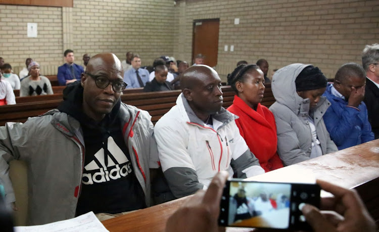 Former Eskom acting CEO Matshela Koko with his co-accused in the Middelburg magistrate's court where he was charged with corruption and fraud linked to a Kusile power station contract in October last year. File photo.