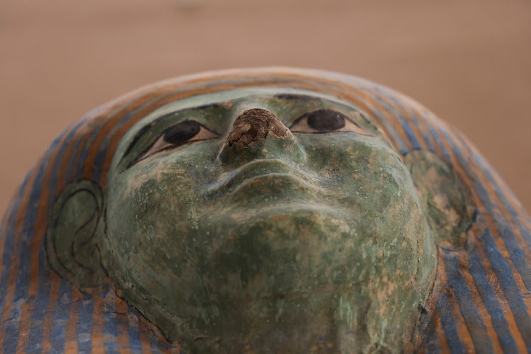 A view of a sarcophagus face found at the newly discovered site where two embalming workshops for humans and animals along with two tombs and a collection of artefacts were also found, near Egypt's Saqqara necropolis, in Giza, Egypt May 27, 2023.