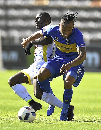Edmilson Dove of Cape Town City, right, and Isac Decarvalho of Costa do Sol clash for the ball.