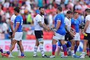 Players shake hands after the Rugby World Cup 2019 Group B game between Italy and Namibia at Hanazono Rugby Stadium on September 22, 2019 in Higashiosaka, Osaka, Japan. 