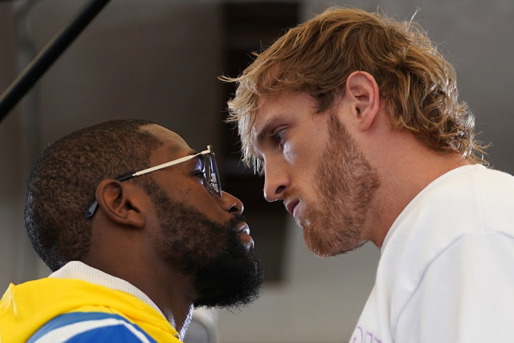 EASY MONEY: Professional boxer Floyd Mayweather Jr. and YouTube star Logan Paul face off at Villa Casa Casuarina in Florida on June 3 2021 Picture: Jasen Vinlove-USA TODAY Sports