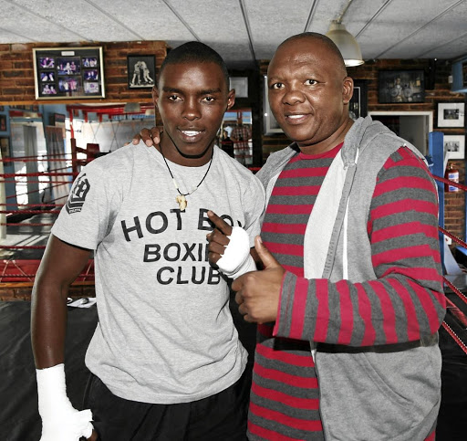 Xolisani 'Nomeva' Ndongeni poses with idol Dingaan 'The Rose of Soweto' Thobela. Ndongeni will headline TLB's tournament on April 6, which Thobela has distanced himself from.