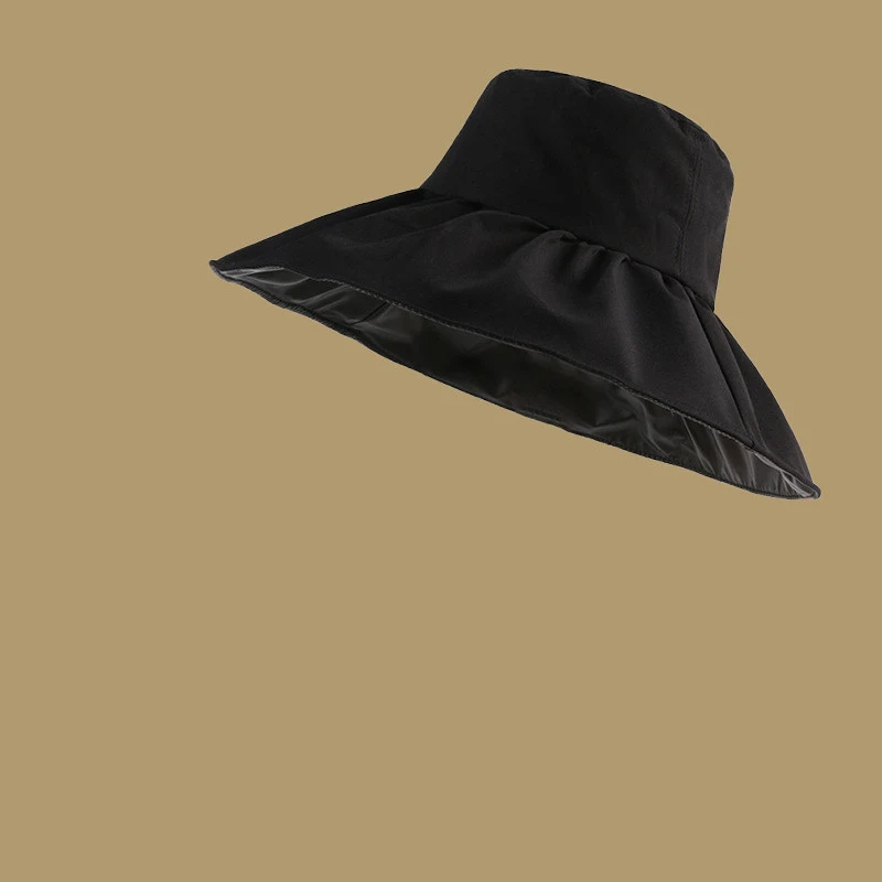 Sombrero de pescador negro de goma para mujer protección anti-ultravioleta ideal para sol y lluvia, cómodo y duradero para actividades al aire libre.