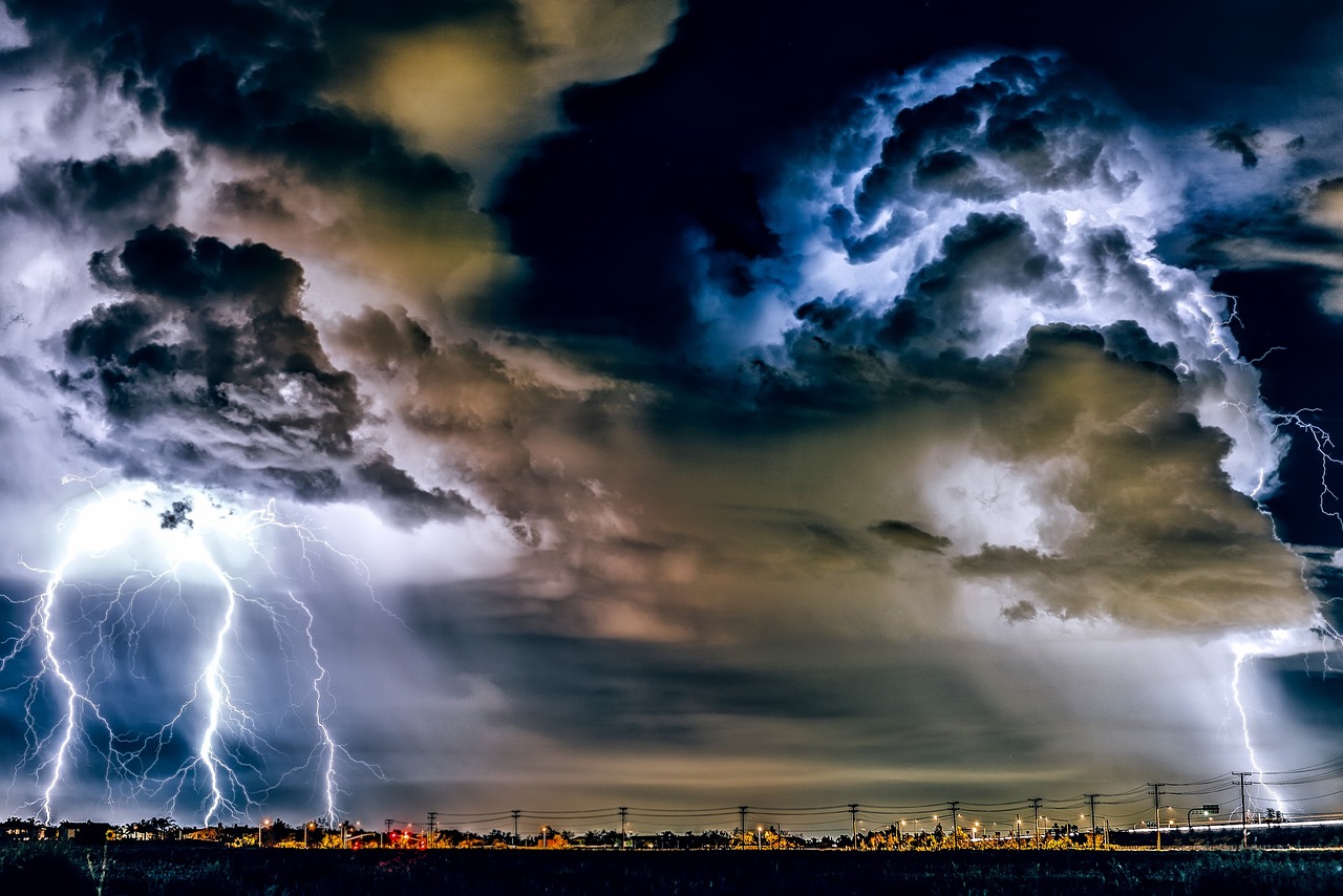 beautiful scene of clouds and thunder weather over a city