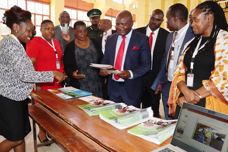 Kakamega Governor Fernandes Barasa is taken through some disaster risk management methods during International Day for Disaster Risk Reduction celebrations at Masinde Muliro University on Tuesday