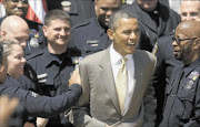 INFLUENTIAL: US President Barack Obama  greets 2012 National Association of Police Organisations Top Cops award winners during a ceremony in the Rose Garden at the White House in Washington at the weekend. PHOTO: REUTERS