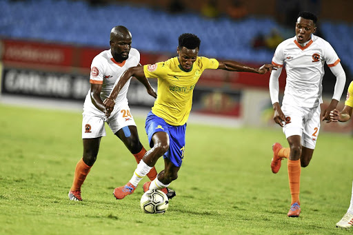 Simphiwe Hlongwane, left, of Polokwane City, tries to close down Themba Zwane of Sundowns during last night's Absa Premiership match at Loftus.