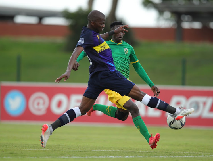 Sbonelo Cele of Golden Arrows challenged by Thamsanqa Mkhize of Cape Town City.