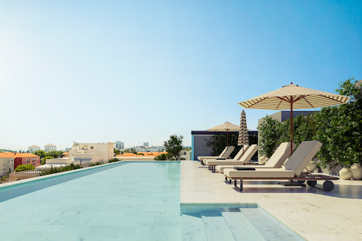 Buy this luxury apartment / penthouse in Lisbon (Portugal) - Infinity pool with lounge chairs