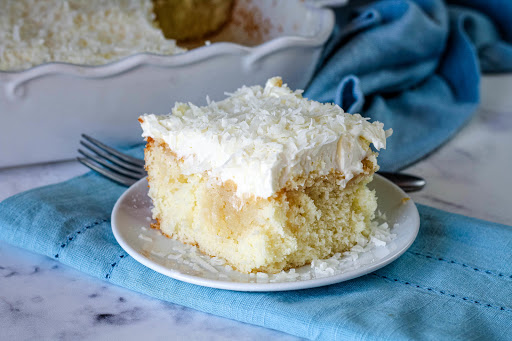 Slice of Coconut Cloud Cake on a plate.