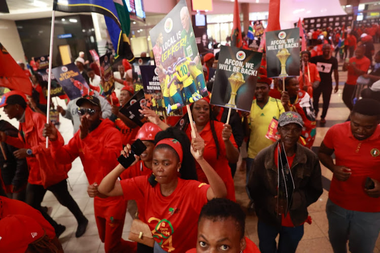 EFF members came out in numbers to welcome Bafana Bafana at OR Tambo International Airport.