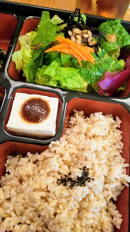 Chef Naoko's Bento Cafe - lunch of natural and organic Japanese cuisine, a bento box meal is served in a lacquered tray with multiple small dishes inside that include a side salad, four side items, steamed rice and organic miso soup