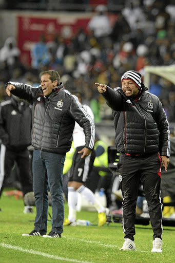 Roger de Sa, left, is capable of coaching Bafana, reckons Tebogo Moloi, right.