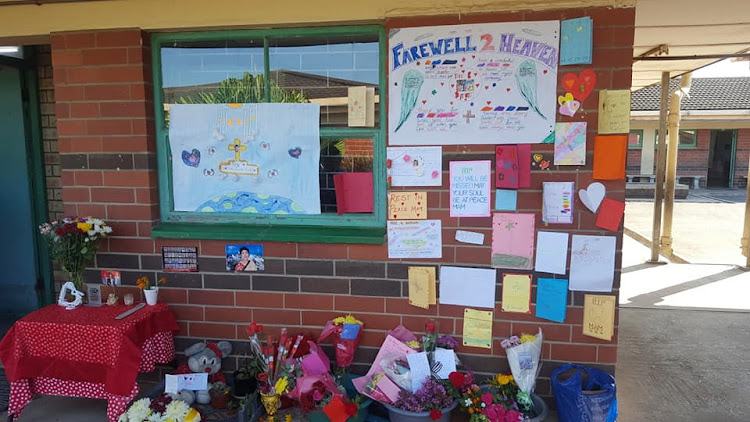 Pupils and teachers at Glenhills Primary School have been placing cards and flowers at a memorial to honour a teacher, Bhanu Dairam, who was found murdered in her home.