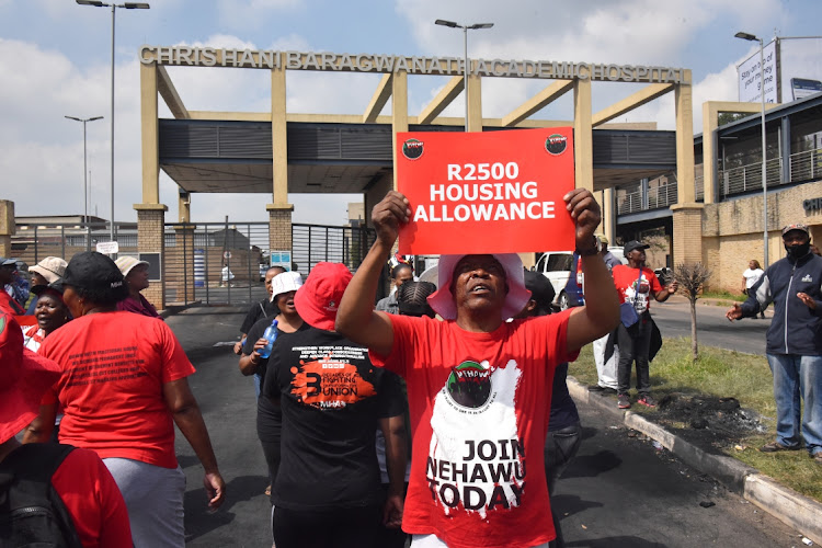 Nehawu members protest outside Chris Hani Baragwanath Academic Hospital in Johannesburg in support of their demands for above-inflation wage increases. Picture: FREDDY MAVUNDA/BUSINESS DAY