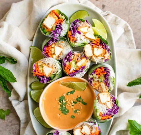 ~20 minutes to prep, ~10 minutes to cook.
Enjoy these flavorful and refreshing peanut tofu spring rolls year round. They’re filled with crisp vegetables, fresh herbs, rice vermicelli noodles, and delicious peanutty tofu.