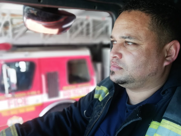 Senior fire fighter, Julliano Medina, focused on the job.