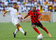 Tshegofatso Nyama of TS Galaxy (right) and Keagan Dolly of Kaizer Chiefs challenge for the ball in the DStv Premiership match at Mbombela Stadium on February 5 2023.