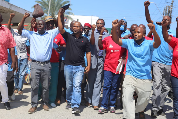 Muhuri rapid response officer Francis Auma, Kisauni MP Ali Mbogo and DWU general secretary Simon Sang lead dock workers in protests in June 2019.