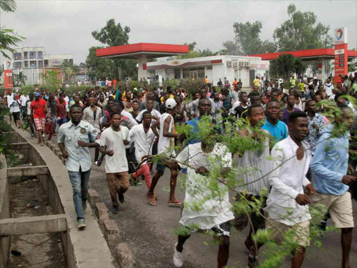 Opposition supporters chant slogans during a march to press President Joseph Kabila to step down in the Democratic Republic of Congo's capital Kinshasa, September 19, 2016. /REUTERS