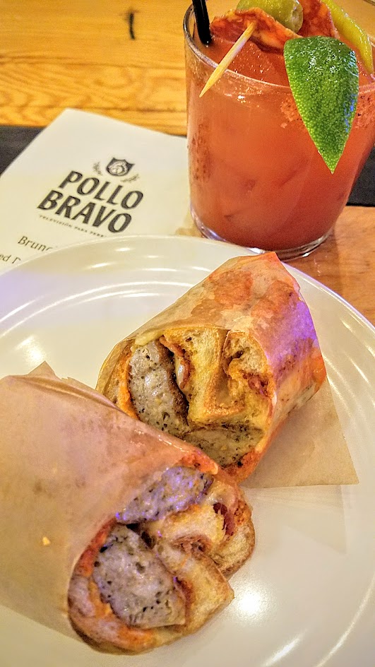 Pollo Bravo brunch at Pine Street Market options of Catalan Sausage Bocadillo with catalan sausage, bacon, mahon, and piquillo peppers with a La Tomatina Bloody Mary with Sobieski vodka, Pollo Bravo Mary mix