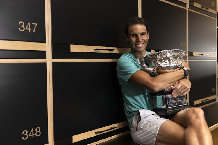 Rafael Nadal poses with Australian Open men’s singles final trophy at the locker room at Melbourne Park on Monday January 31 2022.