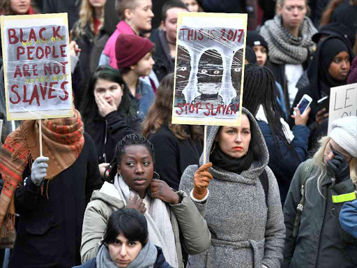 Protestors attend a demonstration against slavery in Libya, in Stockholm, Sweden, November 25, 2017. /REUTERS