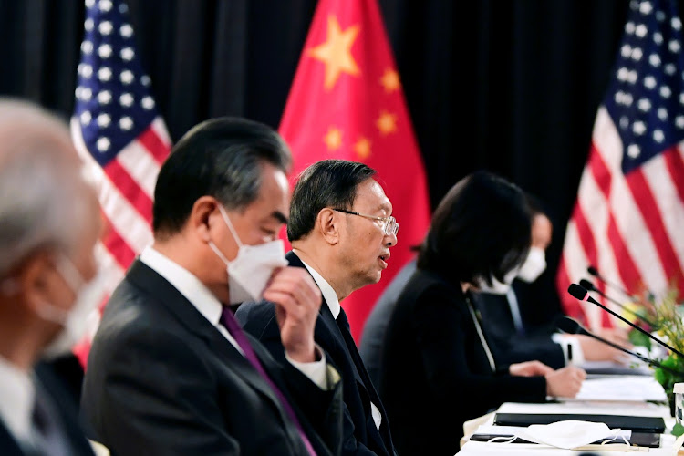 The Chinese delegation led by Yang Jiechi (C), director of the Central Foreign Affairs Commission Office and Wang Yi (2nd L), China's State Councilor and Foreign Minister, speak with their US counterparts at the opening session of US-China talks at the Captain Cook Hotel in Anchorage, Alaska, US March 18, 2021.